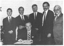 Senior Deputy Assistant Secretary of State, Robert Funseth, and other staff in Hanoi to negotiate and sign the agreement between the U.S. and Vietnam, July 1989